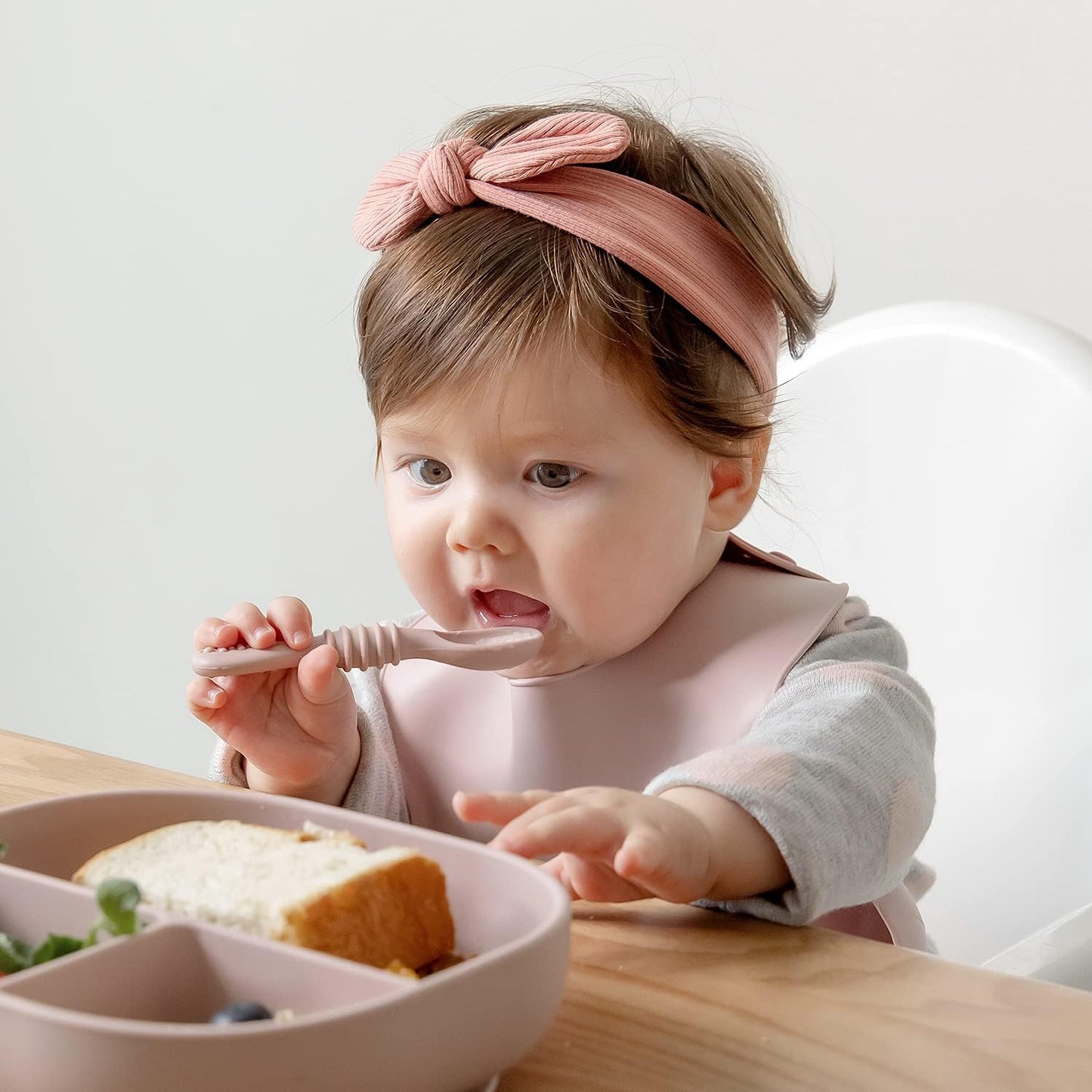 SAMiGO Silicone Baby Utensils - Self Feeding Spoons and Tiny Training Cup - First Stage Baby Led Weaning Supplies for 6 Months+ Infants - Set of 4