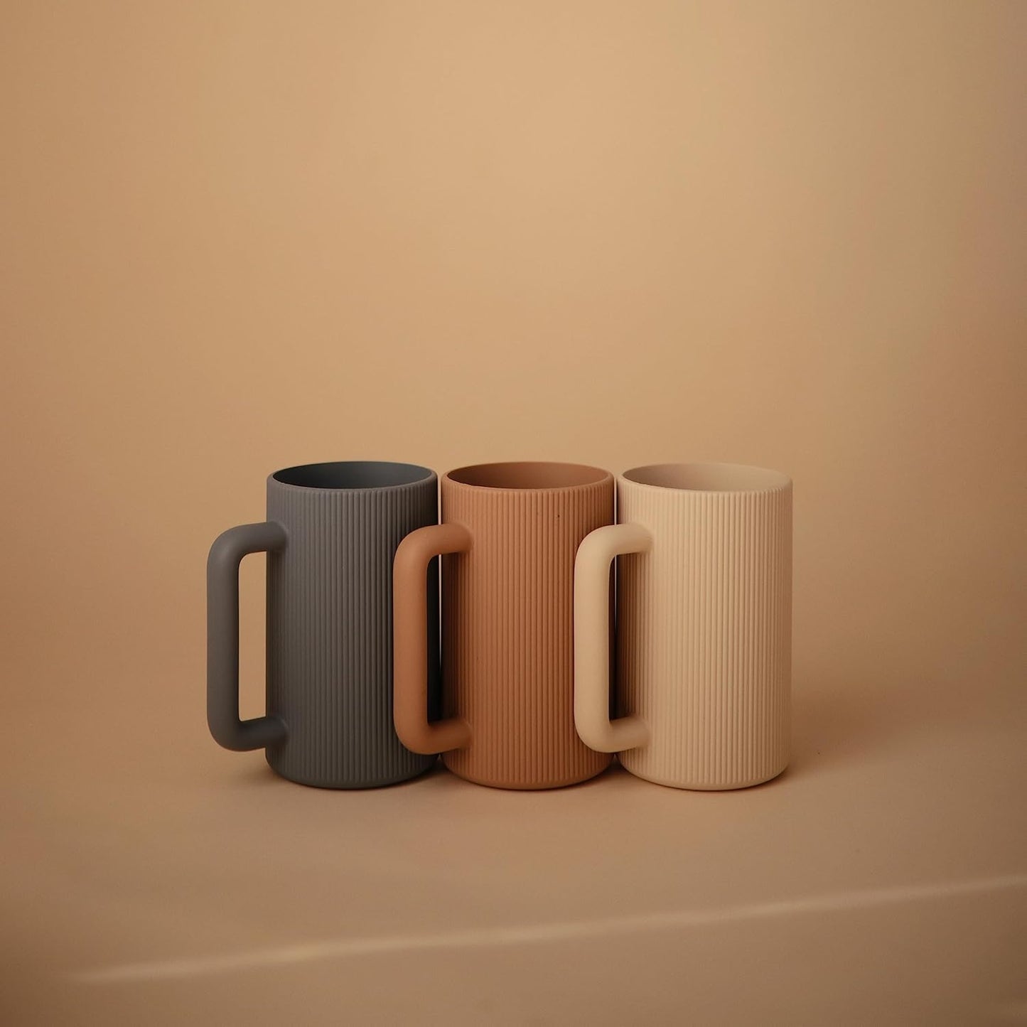 mushie Baby Bath Rinse Cup | 100% Food Grade Silicone | Shampoo & Body Washing Rinser Cup For Kids (Shifting Sand)