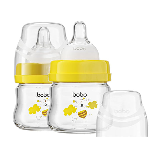 YOHKOH Glass Baby Bottles with Slow Flow Nipple, Newborn Anti-Colic Baby Bottles for 0+ Months, Wide Neck Feeding Bottle, Clear (Yellow, 2.7oz (Pack of 2))