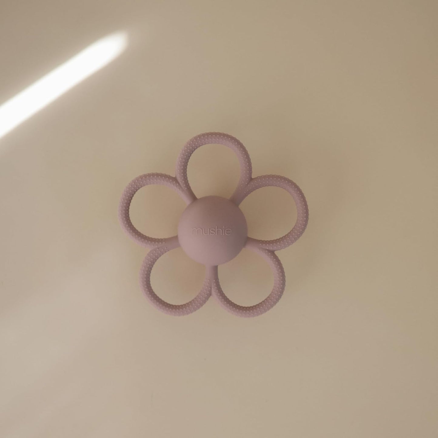 mushie Silicone Baby Daisy Rattle Teether Toy (Soft Lilac)