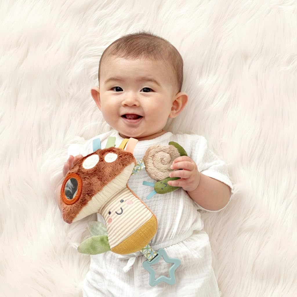 Itzy Ritzy Bitzy Traveler Car Seat & Stroller Toy for Babies – Developmental Sensory Toy Features Crinkle & Rattle Sounds & Multiple Textures –Hanging Travel Toy for On-the-Go Entertainment (Mushroom)