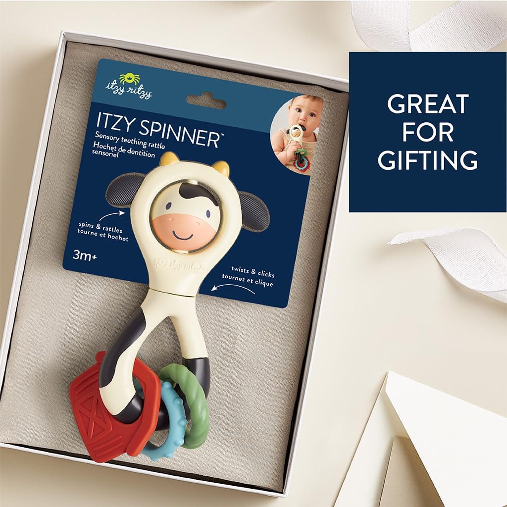 Itzy Ritzy Spinner Rattle Toy – Cow Design Sensory Teething Rattle Includes Spinning Face, Clicks, Rattles & Textured Teethers; Designed for Ages 3 Months and Up (Cow)