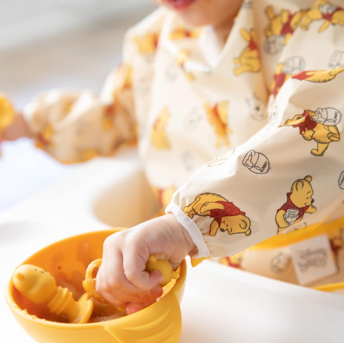 Bumkins Disney Sleeved Bib for Girl or Boy, Baby and Toddler for 6-24 Mos, Essential Must Have for Eating, Feeding, Baby Led Weaning, Long Sleeve Mess Saving Food Catcher, Winnie the Pooh Hunny