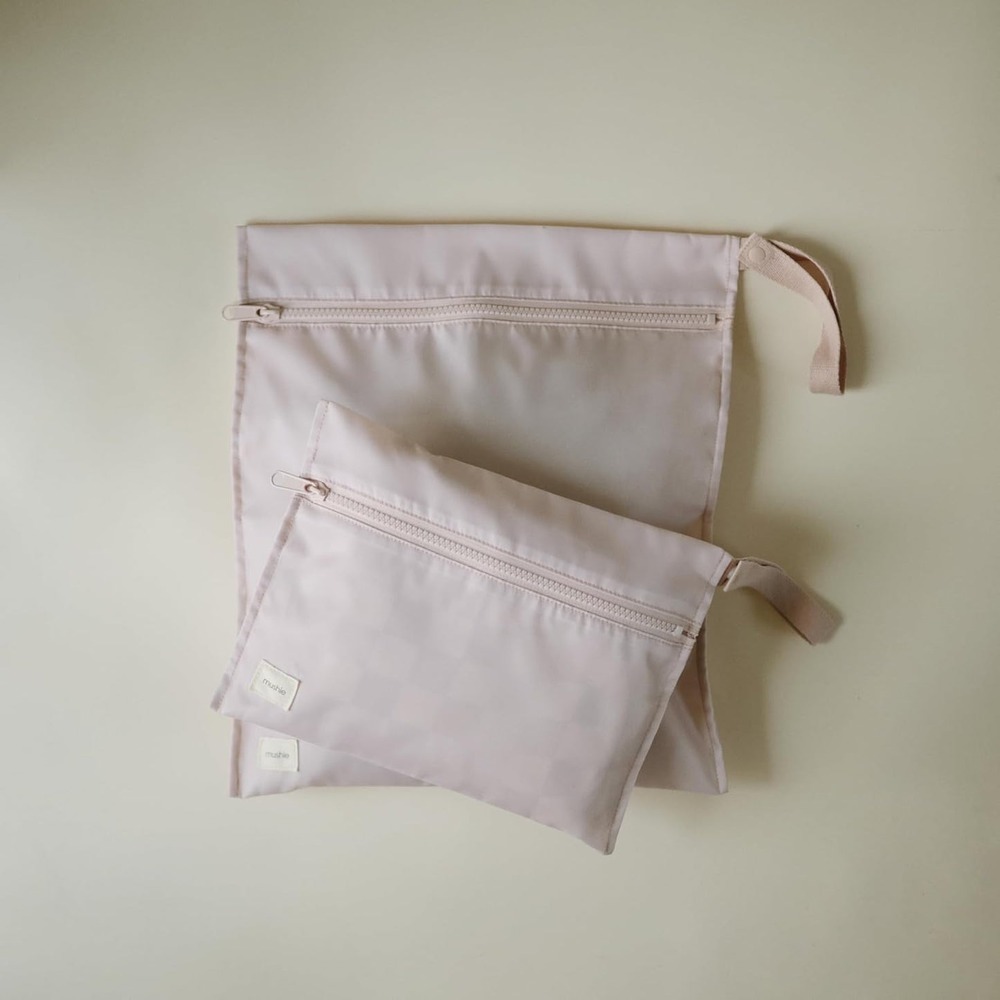 mushie Water Resistant Wet Bags | Large & Small Reusable Storage Bag for Baby Items and Travel | Zippered Pockets with Handle | Machine Washable, Set of 2 (Blush)