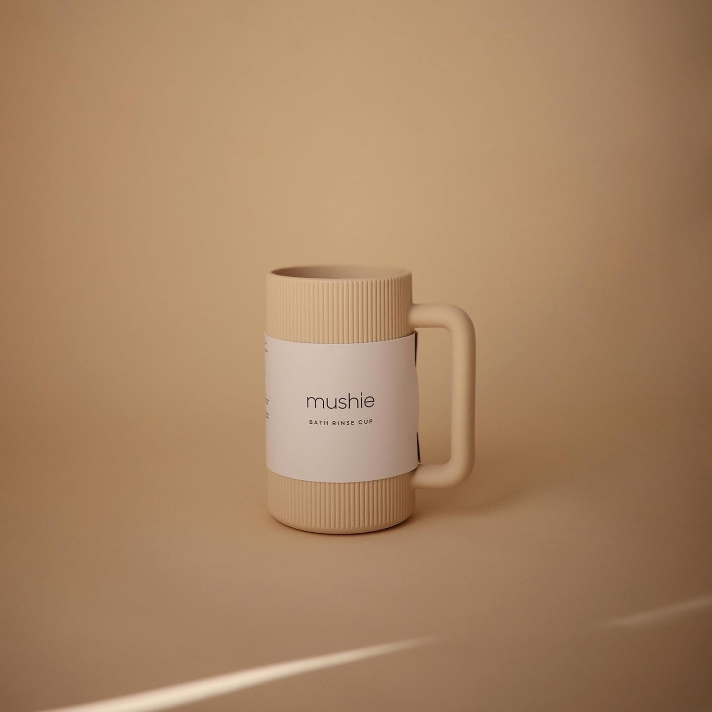 mushie Baby Bath Rinse Cup | 100% Food Grade Silicone | Shampoo & Body Washing Rinser Cup For Kids (Shifting Sand)